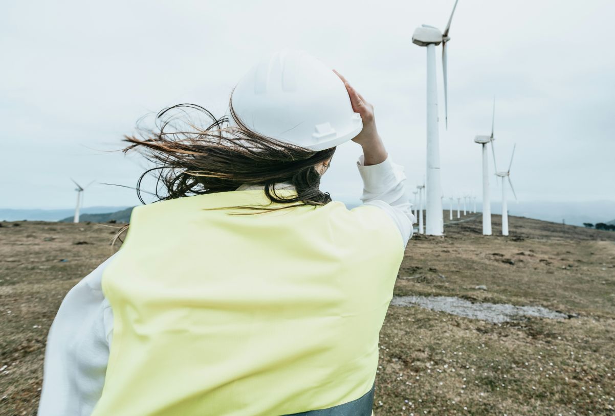 Engineer looking at wind turbine